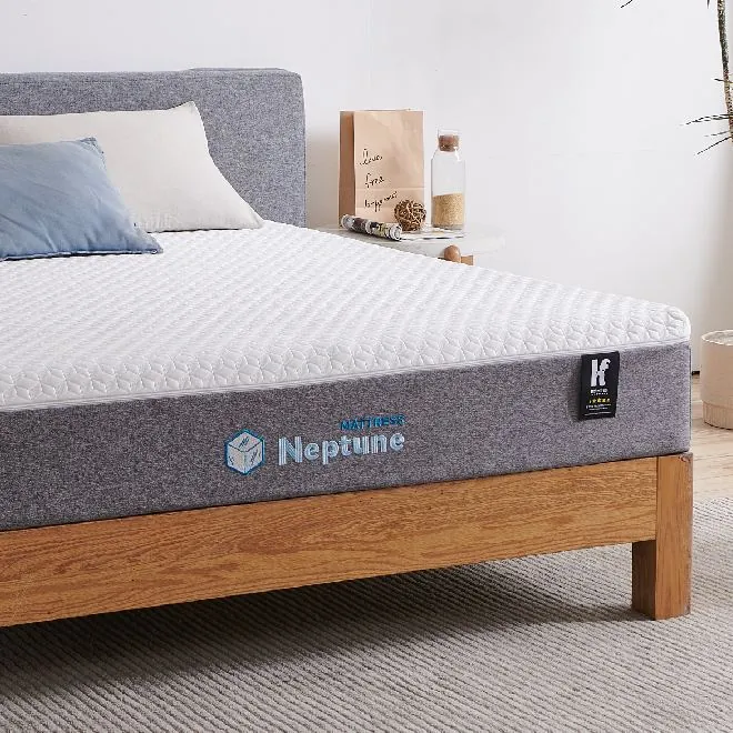Grey Neptune mattress on a wooden bed frame