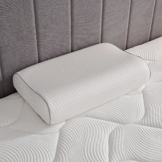Contour memory foam pillow on a quilted mattress